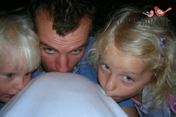 Natural Delivery with spontaneous pushing - kissing belly before baby is born