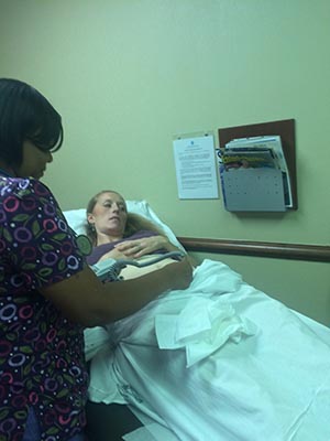 listening-for-heartbeat-using-a-doppler-first-prenatal-visit